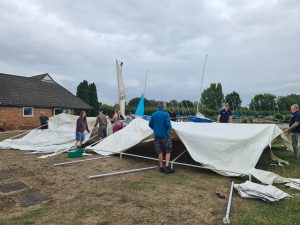 Parents erecting the marquee