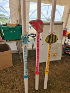 The score tubes for the three teams and their mascots
