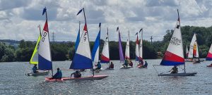 A flotilla of toppers racing - Junior Week 2023