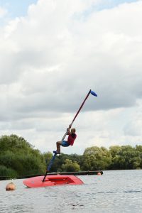 A junior toppling from a mast